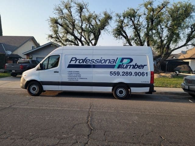 Professional plumber van parked on residential street, featuring contact number 559-289-9061.